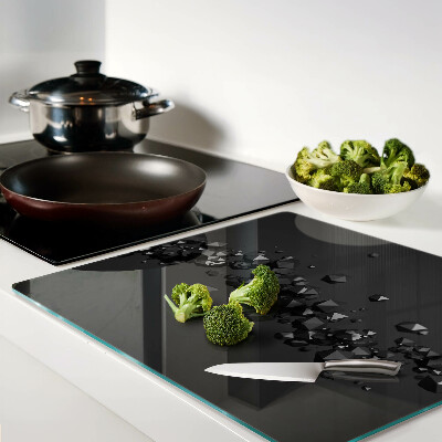 Glass kitchen board Black crystals on the background