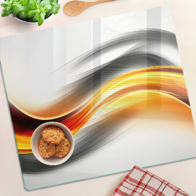 Glass chopping board Waves in orange and black