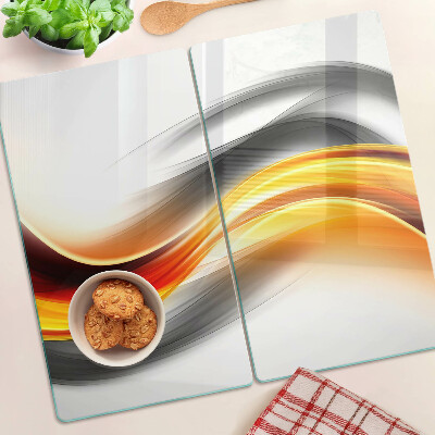 Glass chopping board Waves in orange and black