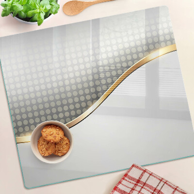 Glass kitchen board Golden wave on a background of dots