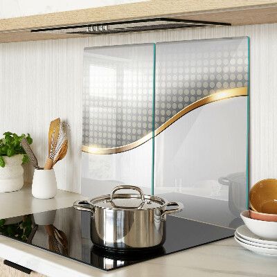 Glass kitchen board Golden wave on a background of dots