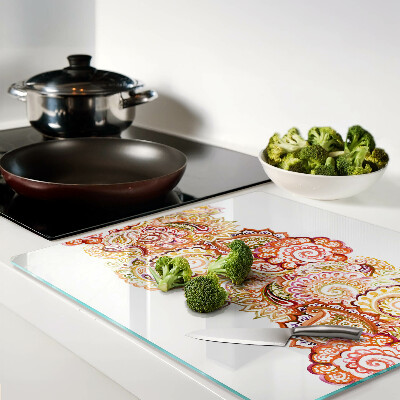 Glass chopping board Paisley motif in shades of red and gold