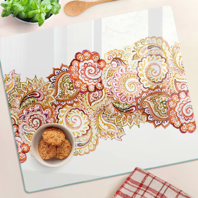 Glass chopping board Paisley motif in shades of red and gold