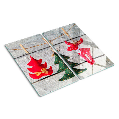 Glass chopping board Christmas decorations on a wooden background