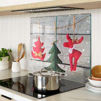 Glass chopping board Christmas decorations on a wooden background