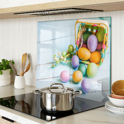 Glass kitchen board Easter colored eggs in a basket