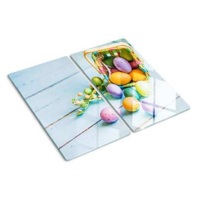 Glass kitchen board Easter colored eggs in a basket