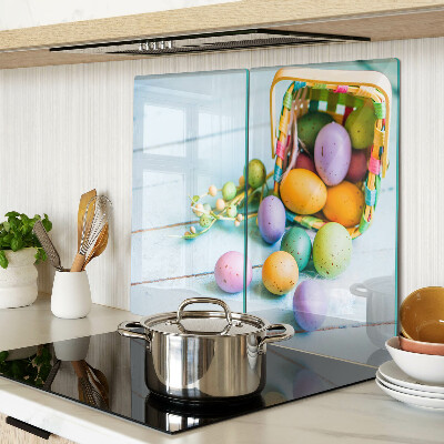 Glass kitchen board Easter colored eggs in a basket