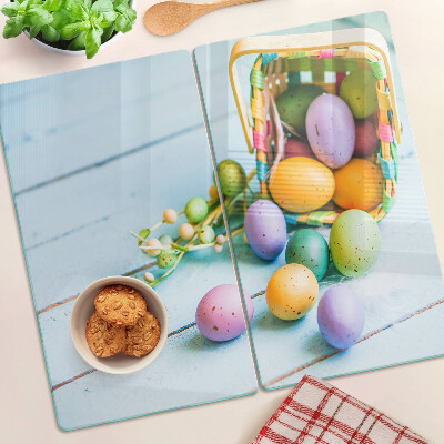 Glass kitchen board Easter colored eggs in a basket