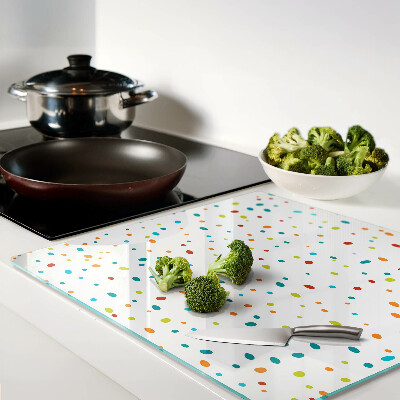 Glass chopping board Colored dots on white background