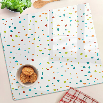 Glass chopping board Colored dots on white background