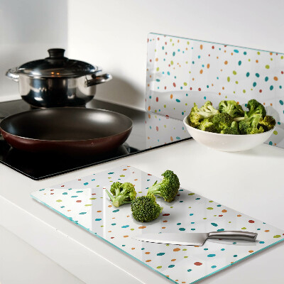 Glass chopping board Colored dots on white background