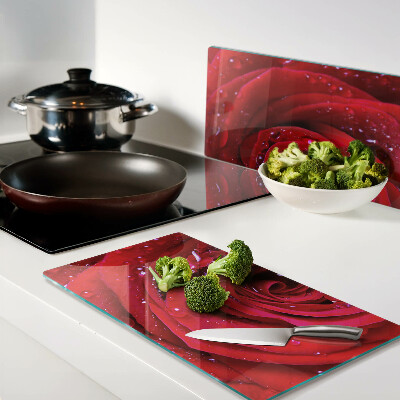 Glass kitchen board Red rose with water drops