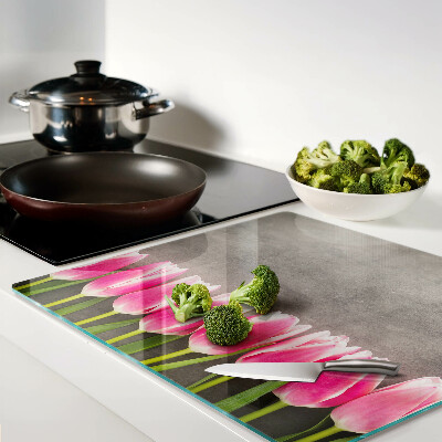 Glass chopping board Tulips on a gray background
