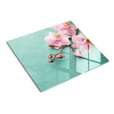 Glass kitchen board Orchids on a blue background