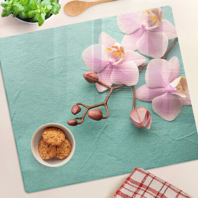 Glass kitchen board Orchids on a blue background