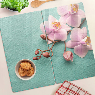 Glass kitchen board Orchids on a blue background