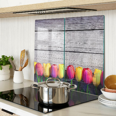 Glass chopping board Tulips on a wooden background