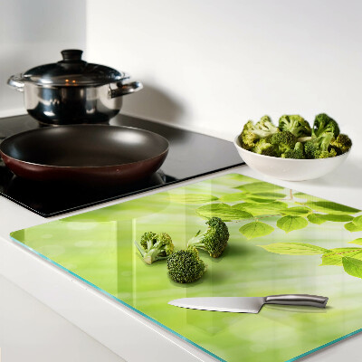 Glass kitchen board Green leaves against the light