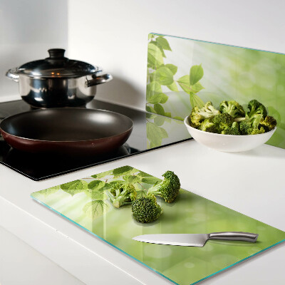 Glass kitchen board Green leaves against the light
