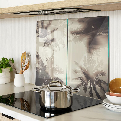 Glass kitchen board Palm trees on a monochrome background