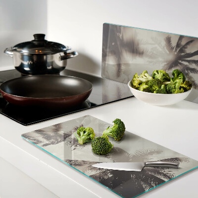 Glass kitchen board Palm trees on a monochrome background
