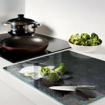 Glass kitchen board Orchid flower on stones