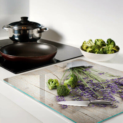 Glass chopping board Lavender in a pot on a wooden background