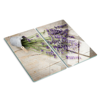 Glass chopping board Lavender in a pot on a wooden background