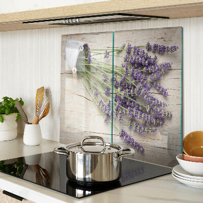 Glass chopping board Lavender in a pot on a wooden background