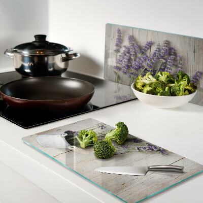 Glass chopping board Lavender in a pot on a wooden background