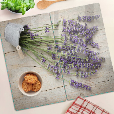 Glass chopping board Lavender in a pot on a wooden background