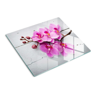 Glass chopping board Orchids on a white background