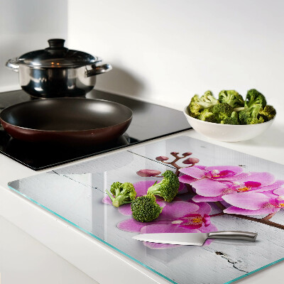 Glass chopping board Orchids on a white background