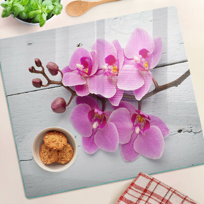 Glass chopping board Orchids on a white background