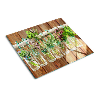 Glass kitchen board Herbs in jars on a wooden background