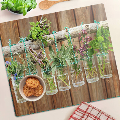 Glass kitchen board Herbs in jars on a wooden background