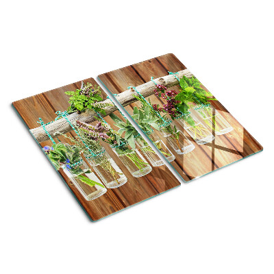 Glass kitchen board Herbs in jars on a wooden background