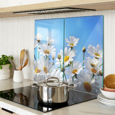 Glass kitchen board Daisy flowers on a blue background