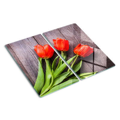 Glass chopping board Tulips on a wooden background