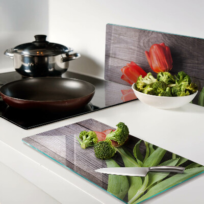 Glass chopping board Tulips on a wooden background