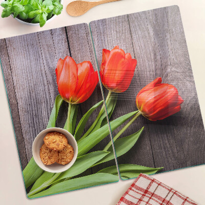 Glass chopping board Tulips on a wooden background