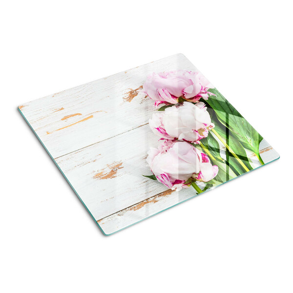 Glass kitchen board Peony flowers on a wood background