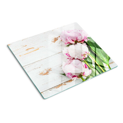 Glass kitchen board Peony flowers on a wood background