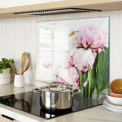 Glass kitchen board Peony flowers on a wood background