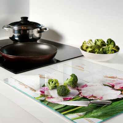 Glass kitchen board Peony flowers on a wood background