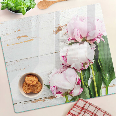 Glass kitchen board Peony flowers on a wood background