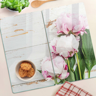 Glass kitchen board Peony flowers on a wood background