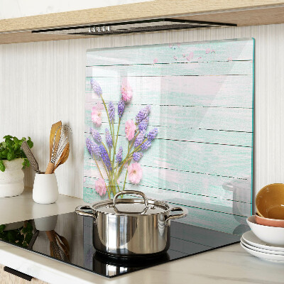 Glass chopping board Flowers on a wooden background