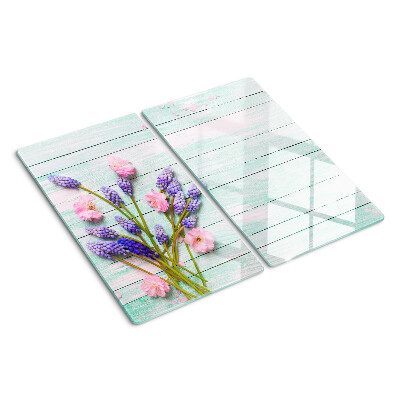 Glass chopping board Flowers on a wooden background
